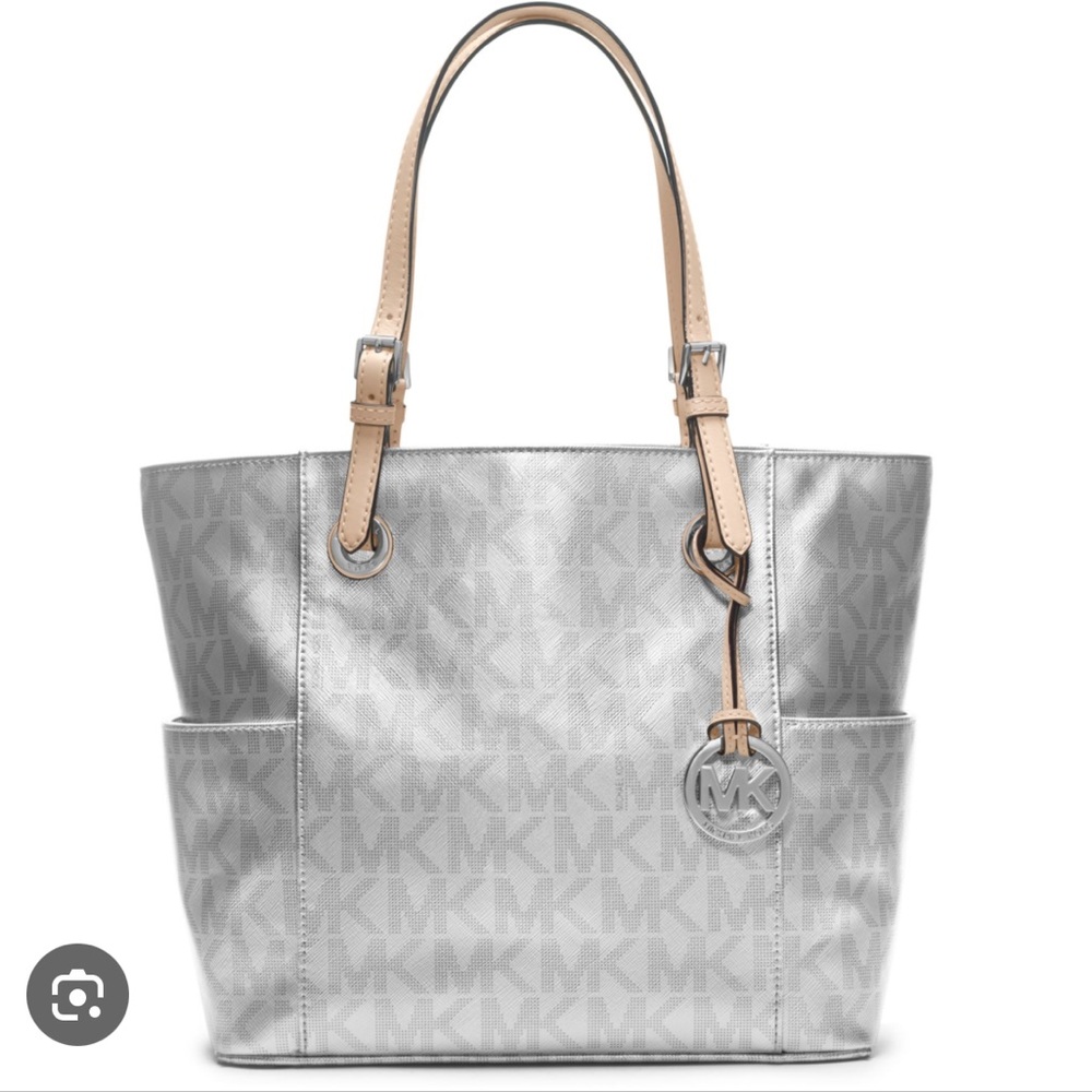 Never been worn Michael Kors Silver Metallic Purse! Matching wallet on my page!